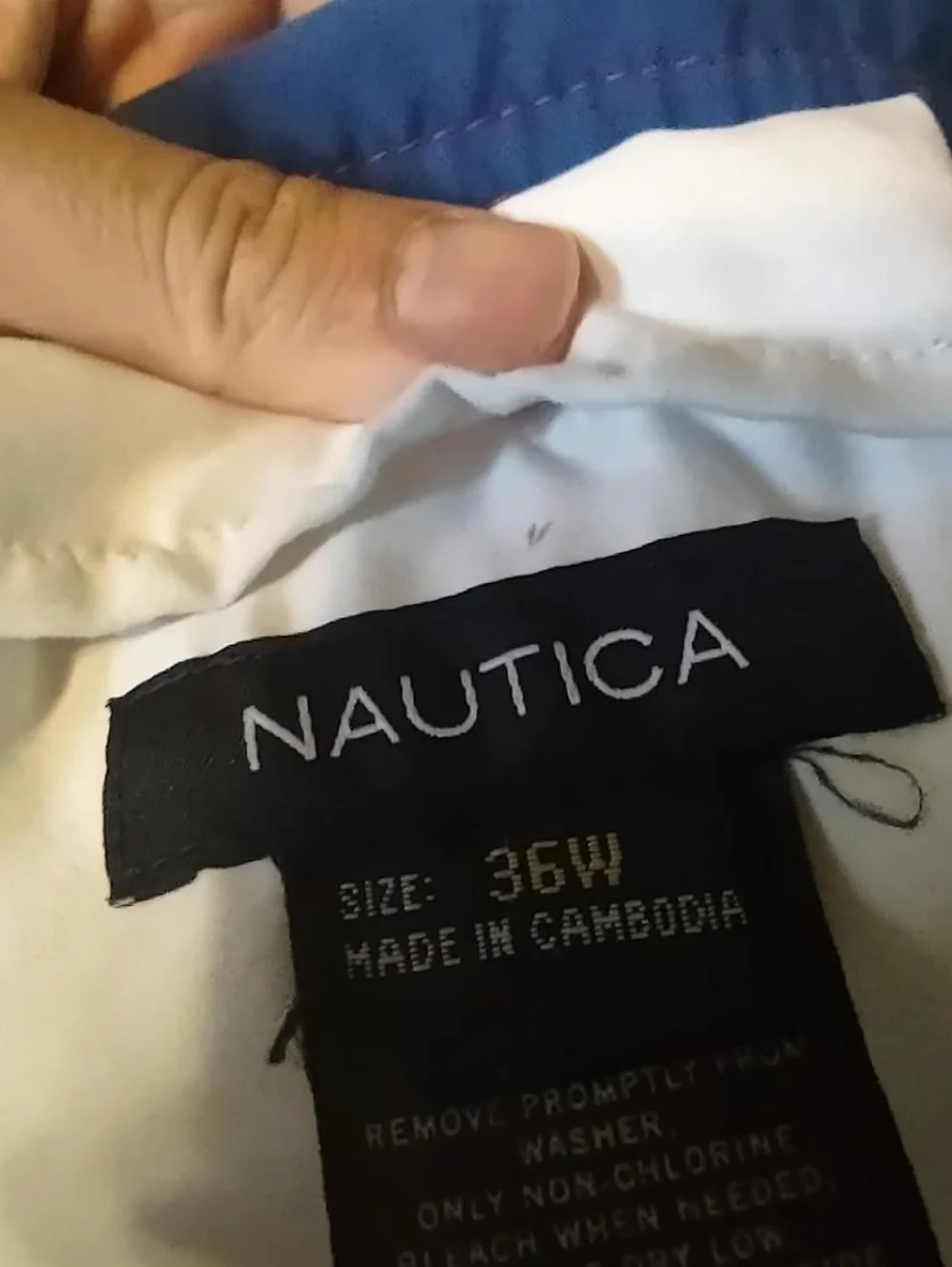 red swim trunks with navy blue back and blue and white stripes from nautica 36W